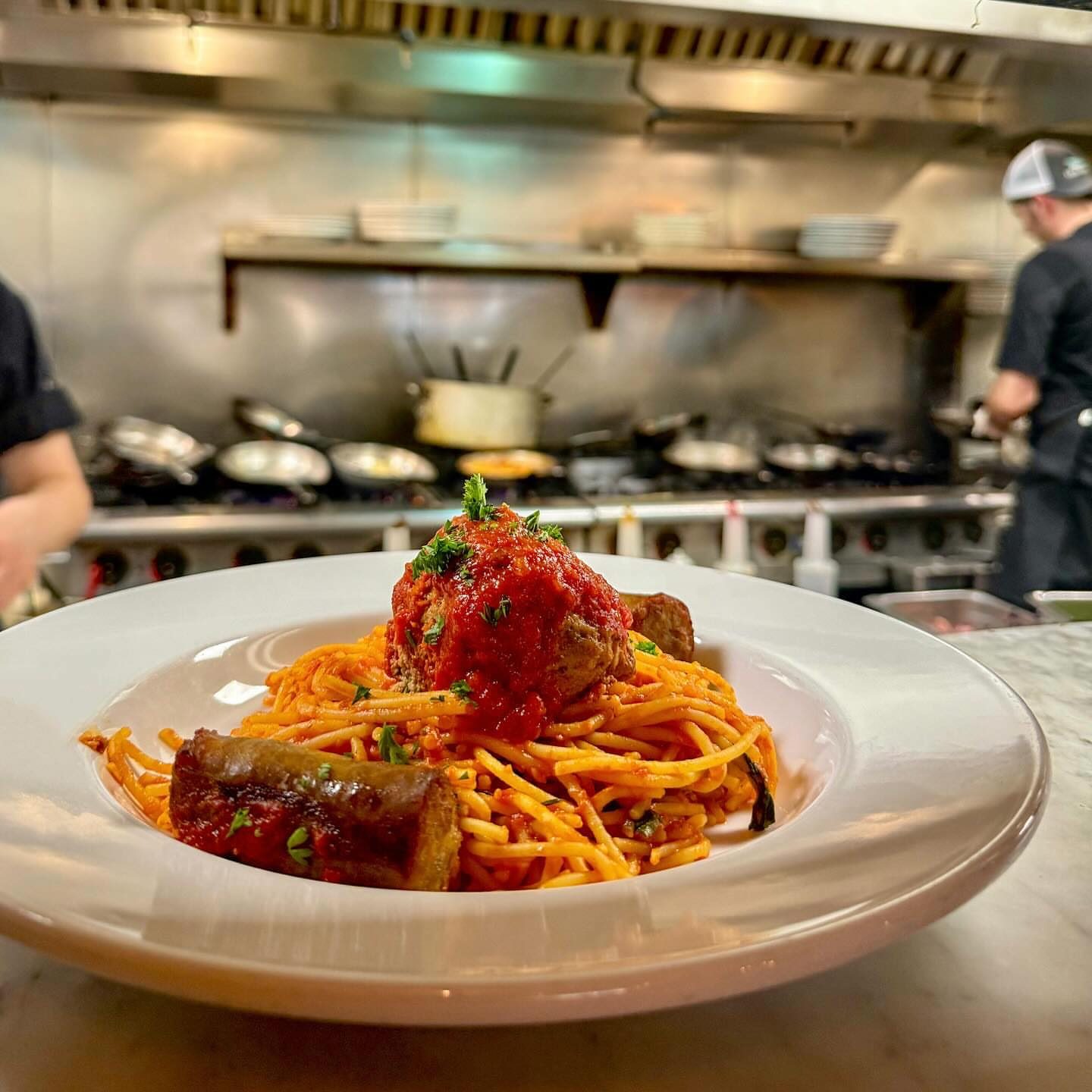 Spaghetti Cicchetti with meatball and Italian sausage on the kitchen pass